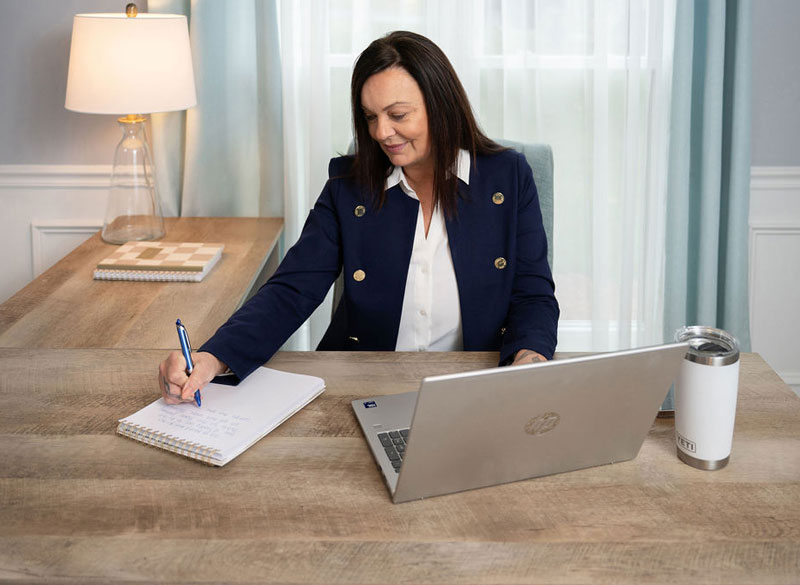 michelle french human resources manager working at her desk